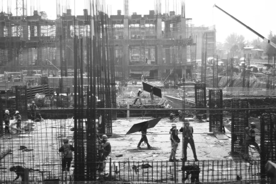 Historical construction site showcasing BCD Global's legacy of building excellence since 1952